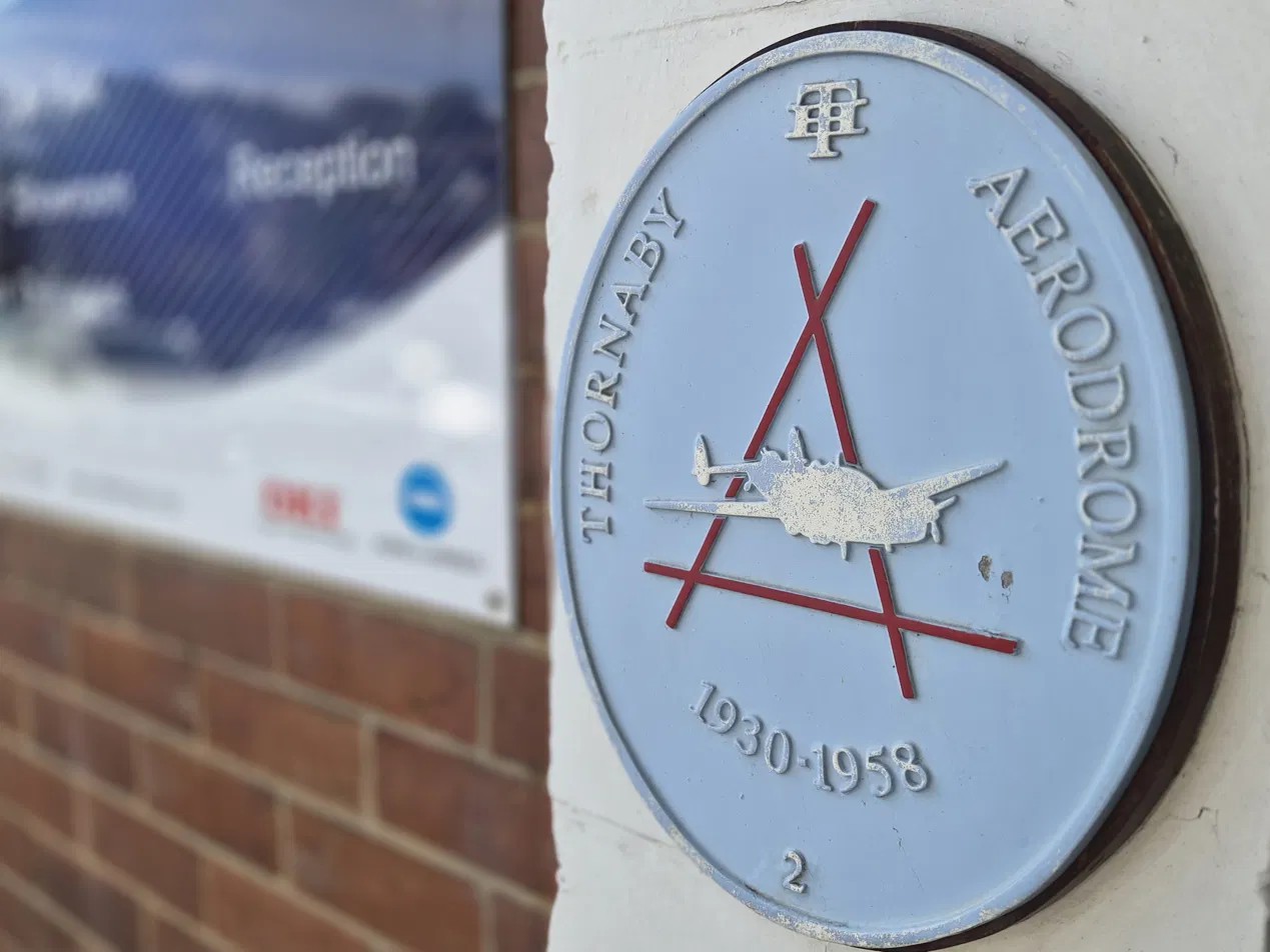 Thornaby Aerodrome heritage plaque on the wall of the building today