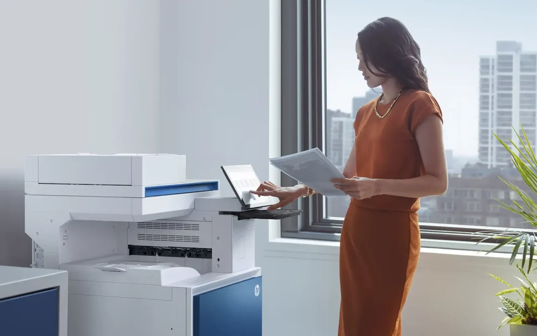 Woman standing by a HP printer